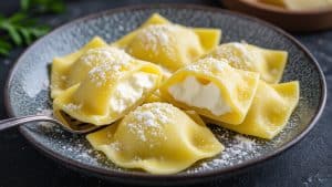 Cut beet cappelletti showing lemon‑zested goat cheese inside